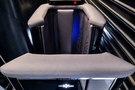op-down view of a cryotherapy chamber at Primal Recovery in Moorabbin, featuring padded arm rests, insulated interior lining, digital control panel, and industrial recovery setting.