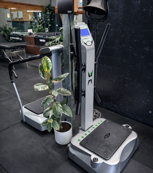 Whole-body vibration platform used to stimulate muscles and increase circulation.